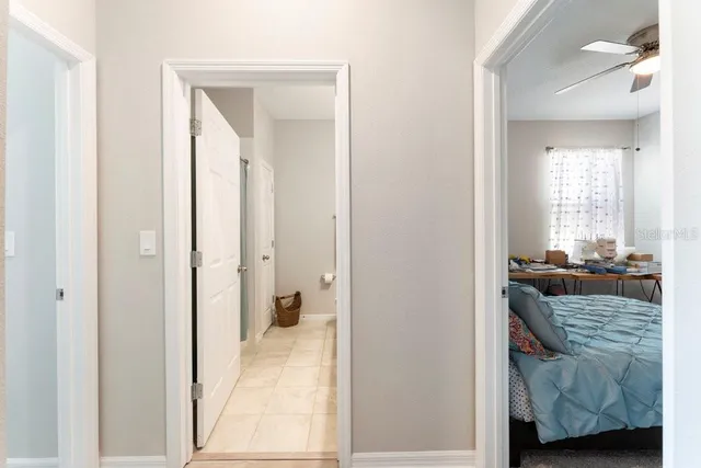 a bathroom with a double vanity sink toilet and a mirror