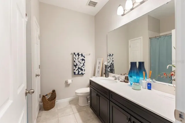 a bathroom with a glass shower door