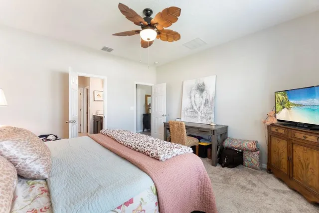 a bathroom with a double vanity sink mirror and shower