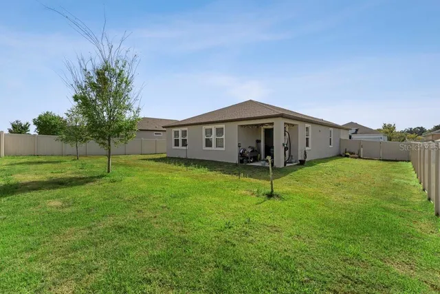 a view of a house with a big yard