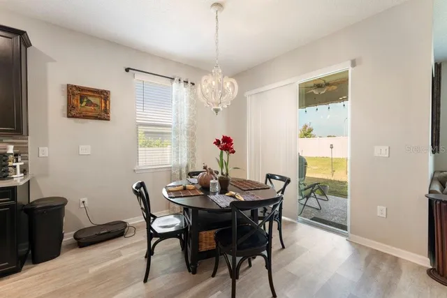 a kitchen with kitchen island granite countertop a sink appliances and cabinets