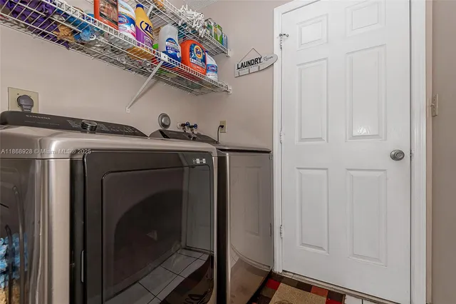 a utility room with dryer and washer