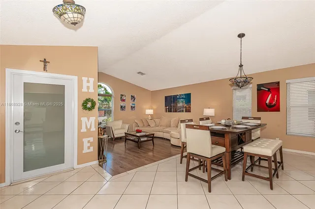 a view of a livingroom with furniture and a window