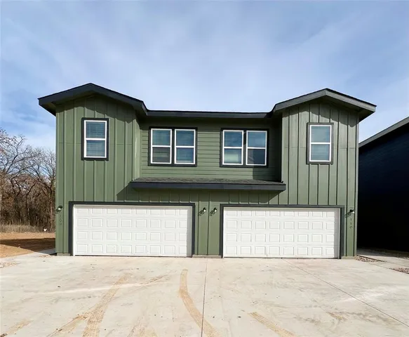 a front view of a house with yard