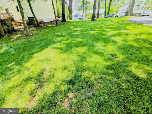 a view of yard with swimming pool