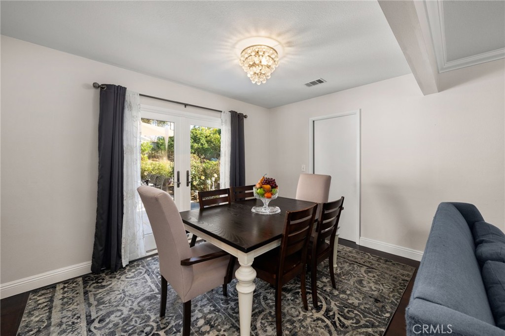 1274 Muirfield Road Riverside, CA 92506 - Photo 11 of 48 a view of a dining room with furniture and a window
