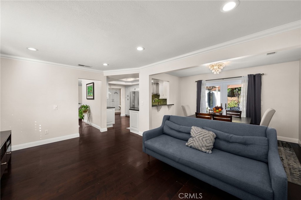 1274 Muirfield Road Riverside, CA 92506 - Photo 14 of 48 a living room with furniture and wooden floor