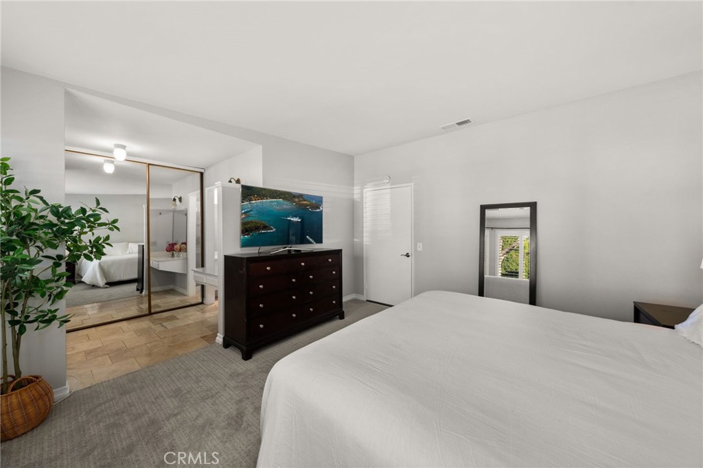 1274 Muirfield Road Riverside, CA 92506 - Photo 17 of 48 a bedroom with a bed and a television