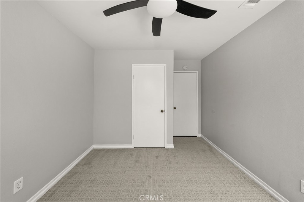 1274 Muirfield Road Riverside, CA 92506 - Photo 21 of 48 an empty room with ceiling fan