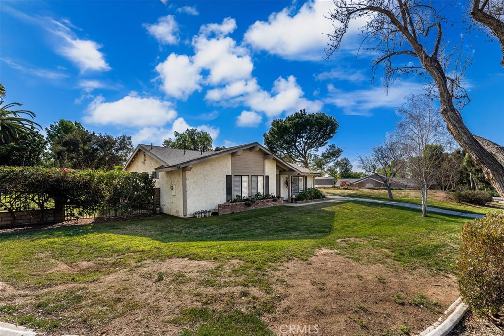 1274 Muirfield Road Riverside, CA 92506 - Photo 27 of 48 a view of a house with a yard