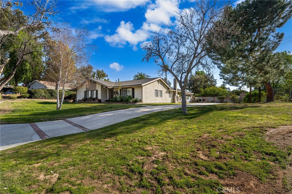1274 Muirfield Road Riverside, CA 92506 - Photo 29 of 48 a front view of a house with garden