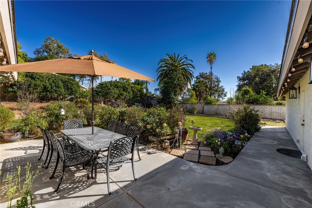 1274 Muirfield Road Riverside, CA 92506 - Photo 35 of 48 an outdoor space with furniture and umbrella