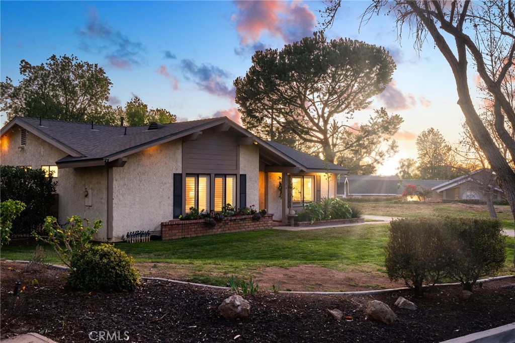 1274 Muirfield Road Riverside, CA 92506 - Photo 41 of 48 a front view of a house with garden