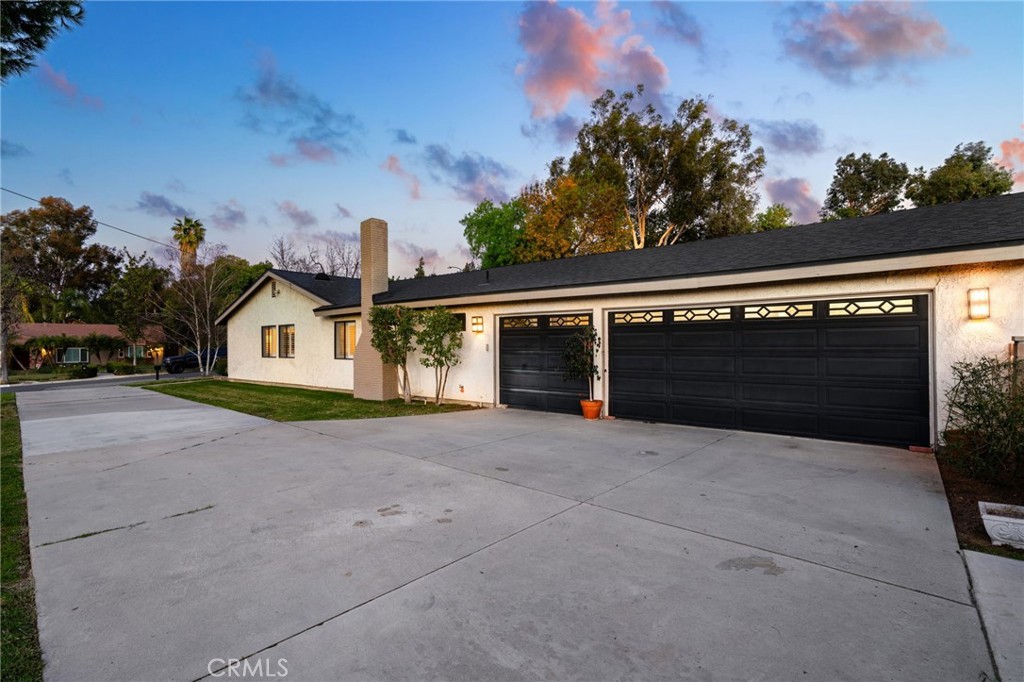 1274 Muirfield Road Riverside, CA 92506 - Photo 43 of 48 a view of house with garage and yard