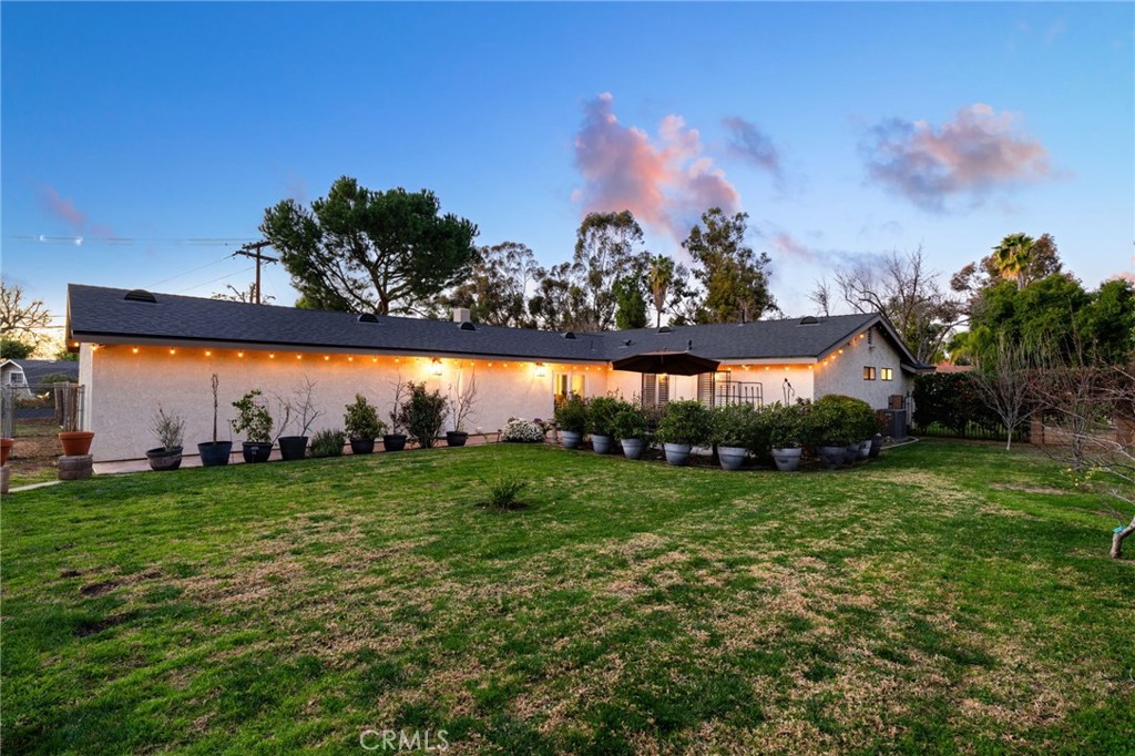 1274 Muirfield Road Riverside, CA 92506 - Photo 46 of 48 a view of a big yard with a large tree
