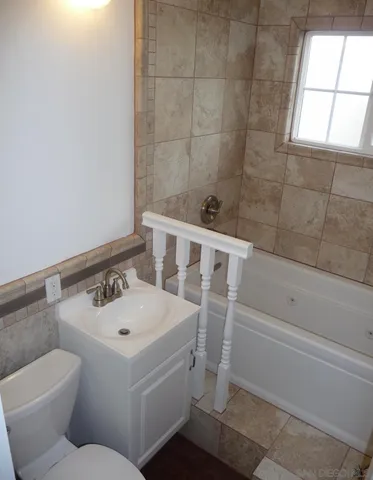 a view of a dining room with furniture and window