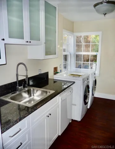 a view of a dining room with furniture and window