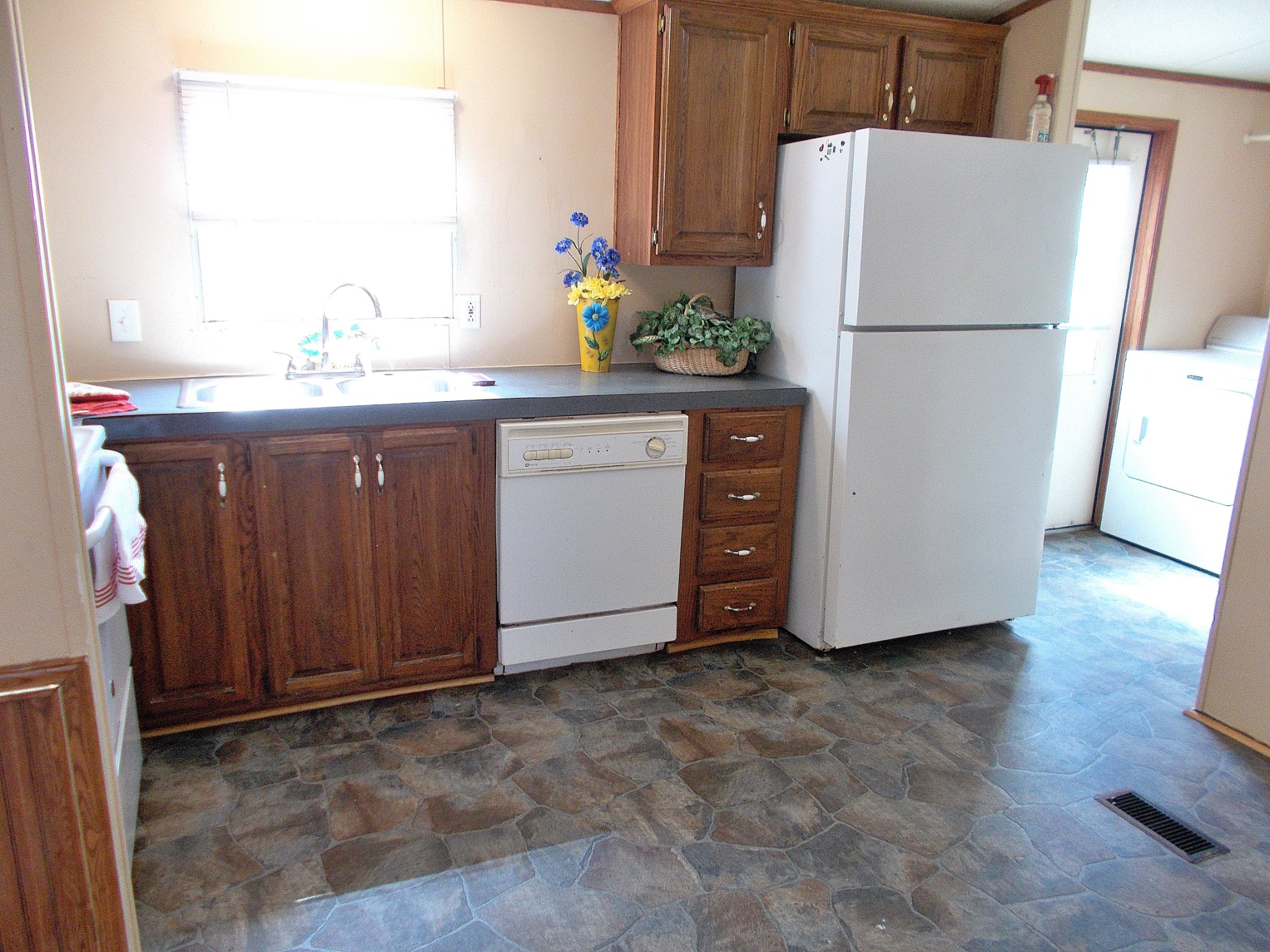 5251 Morgan Creek Road Centerville, TN 37033 - Photo 12 of 31 a white refrigerator freezer sitting in a kitchen