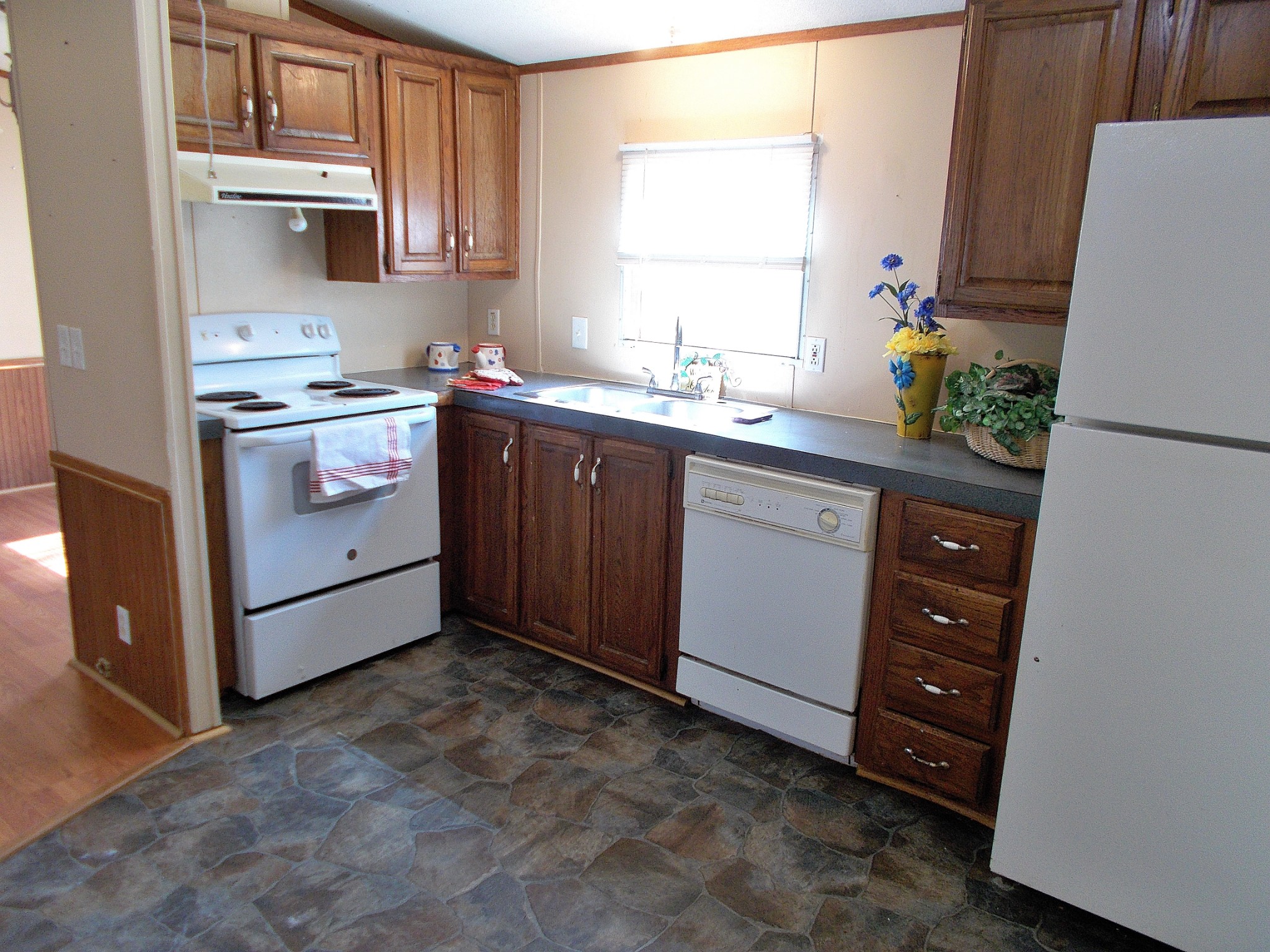 5251 Morgan Creek Road Centerville, TN 37033 - Photo 13 of 31 a kitchen with stainless steel appliances a stove a sink and a refrigerator