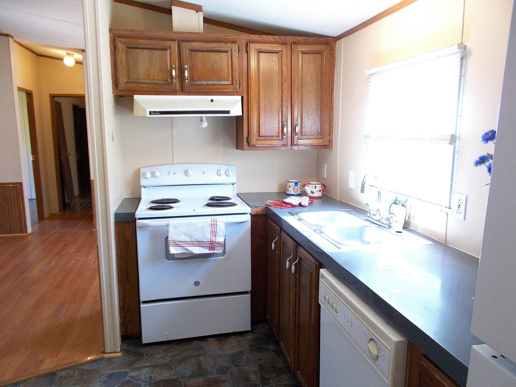 5251 Morgan Creek Road Centerville, TN 37033 - Photo 14 of 31 a kitchen with stainless steel appliances granite countertop a sink stove and refrigerator
