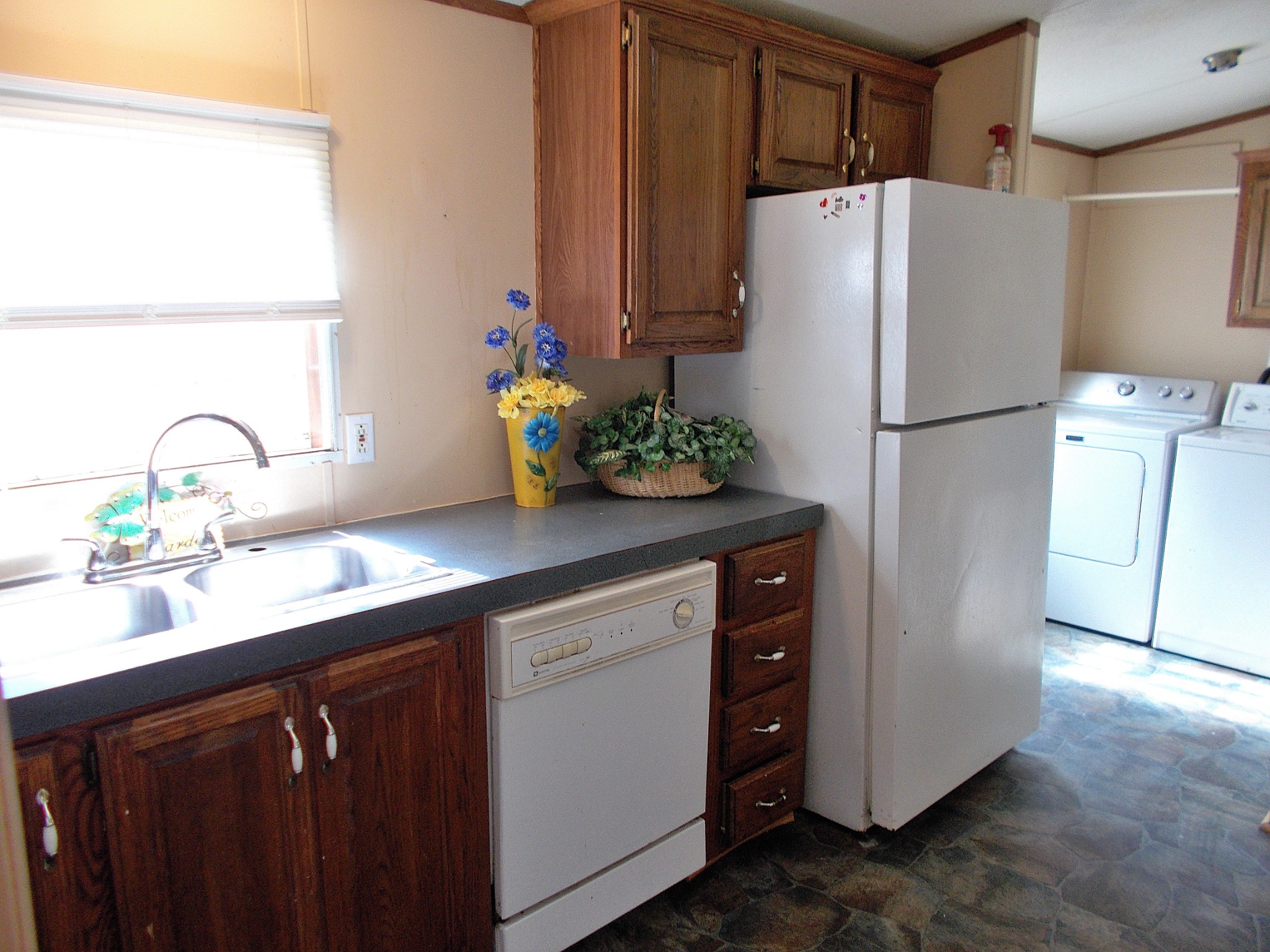 5251 Morgan Creek Road Centerville, TN 37033 - Photo 15 of 31 a white kitchen with sink and refrigerator