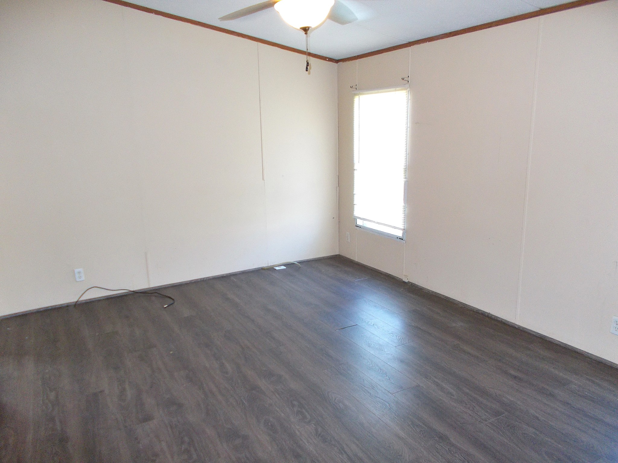 5251 Morgan Creek Road Centerville, TN 37033 - Photo 18 of 31 an empty room with wooden floor and windows