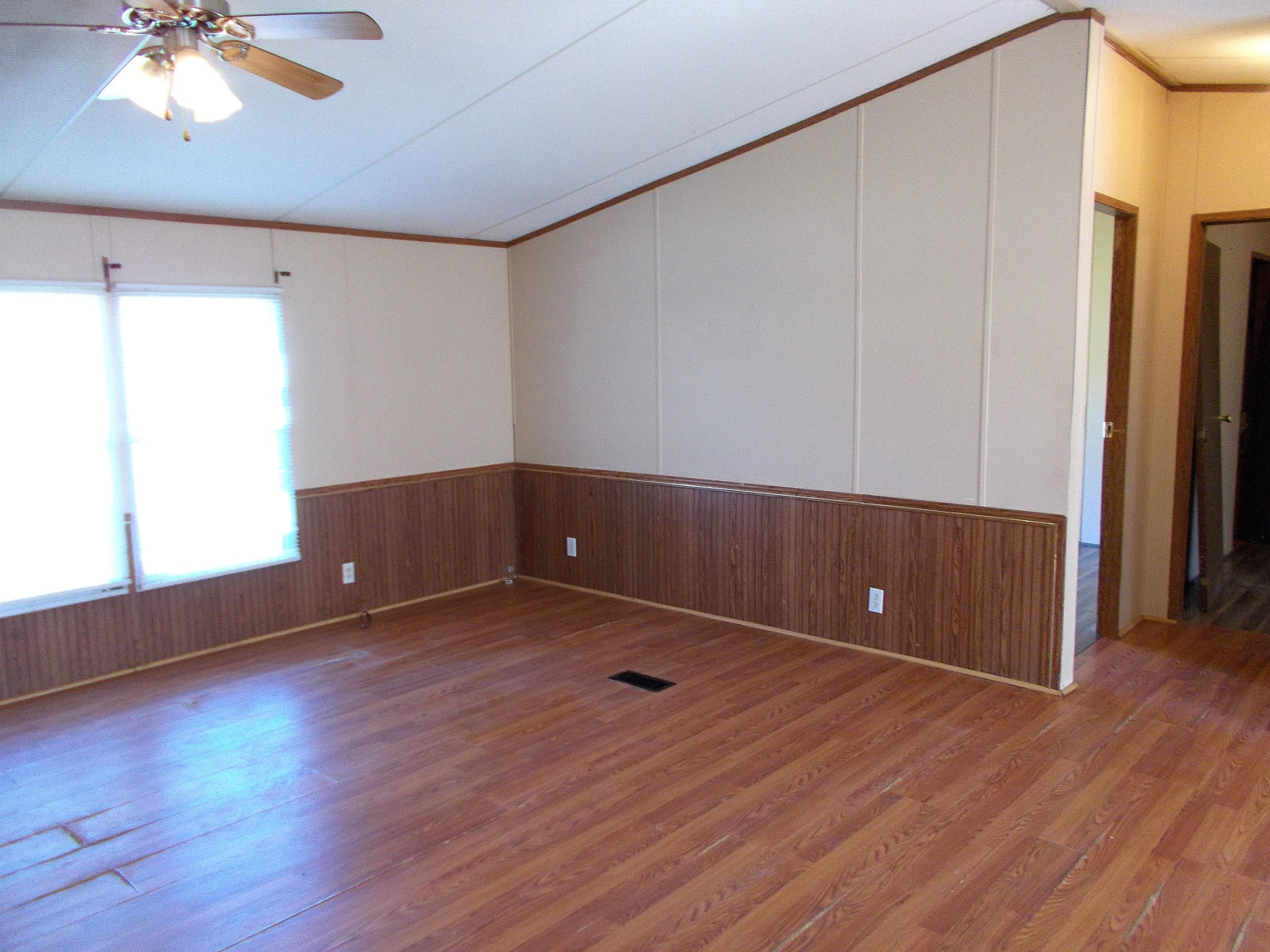 5251 Morgan Creek Road Centerville, TN 37033 - Photo 5 of 31 a view of an empty room with wooden floor and a window