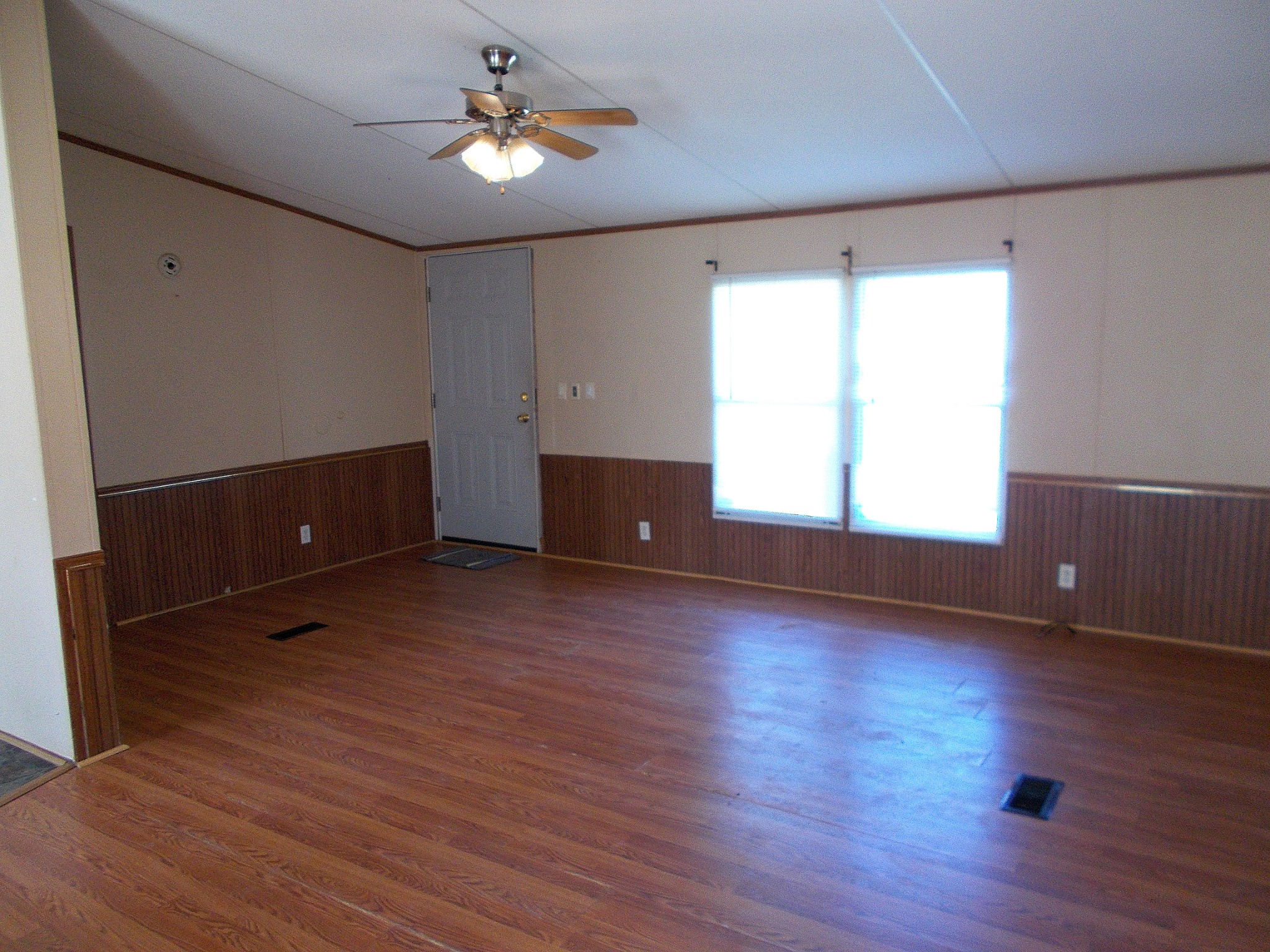 5251 Morgan Creek Road Centerville, TN 37033 - Photo 6 of 31 an empty room with wooden floor and windows
