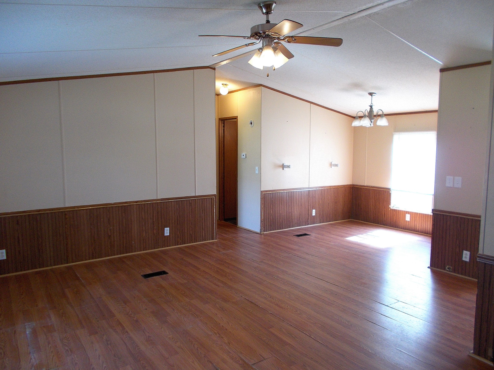 5251 Morgan Creek Road Centerville, TN 37033 - Photo 7 of 31 a view of a room with wooden floor and ceiling fan