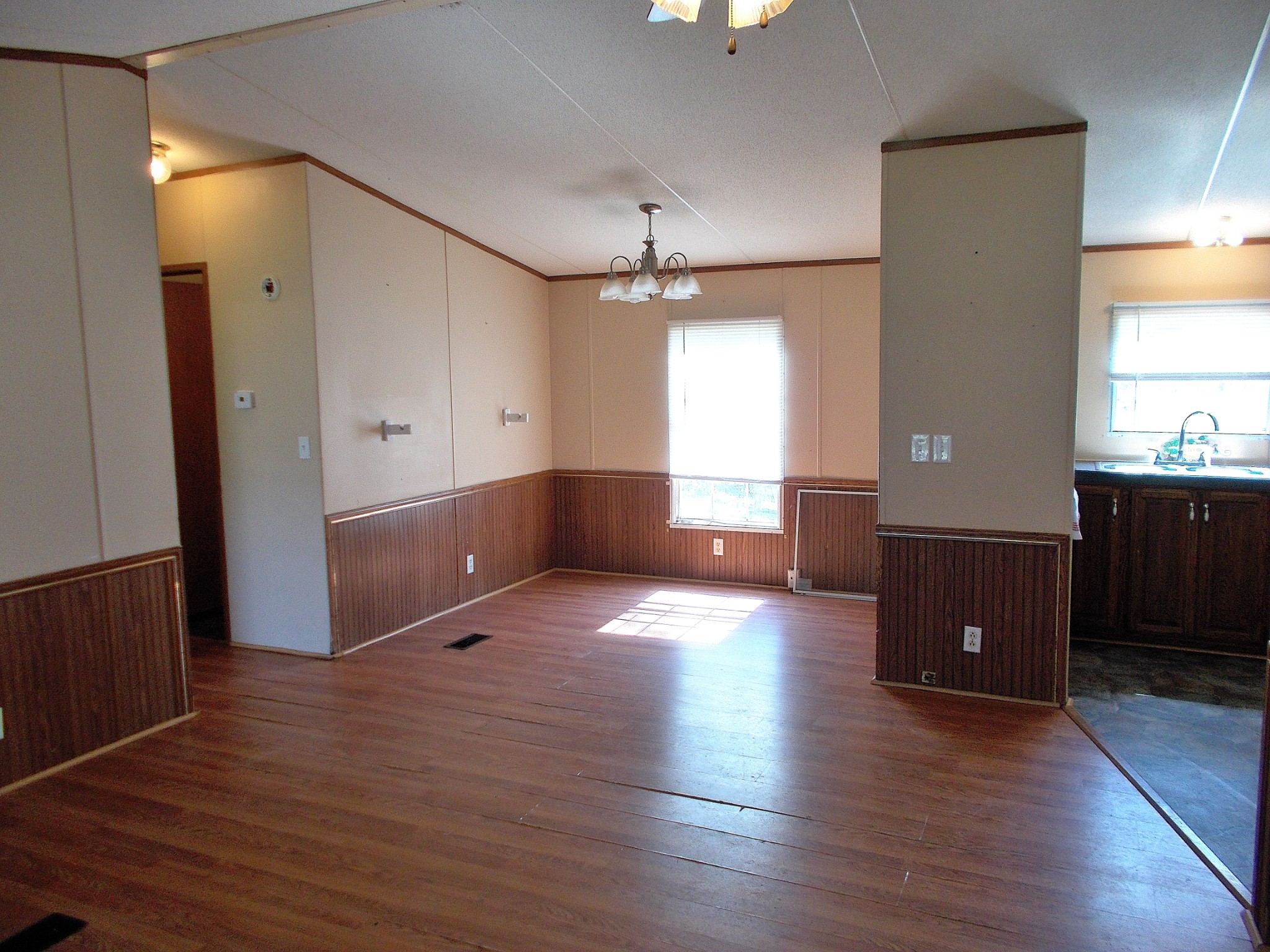5251 Morgan Creek Road Centerville, TN 37033 - Photo 9 of 31 an empty room with wooden floor and windows