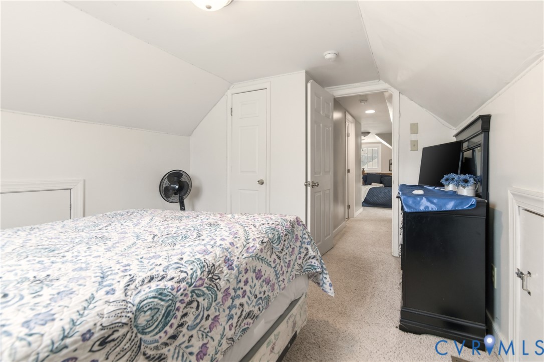 1311 Williamsburg Road Richmond, VA 23231 - Photo 15 of 32 a bedroom with a bed and a fireplace