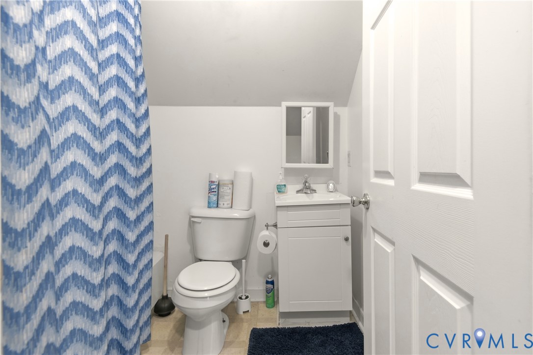 1311 Williamsburg Road Richmond, VA 23231 - Photo 21 of 32 a bathroom with a sink toilet and mirror