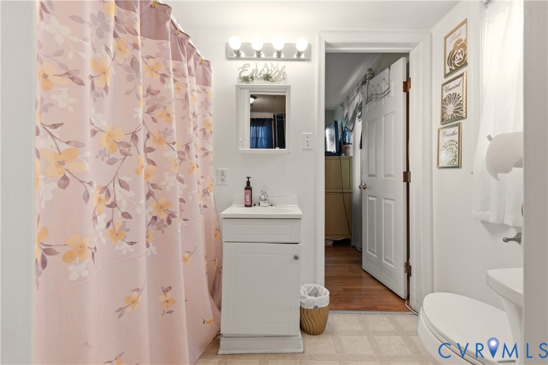 1311 Williamsburg Road Richmond, VA 23231 - Photo 7 of 32 a bathroom with a sink and a mirror