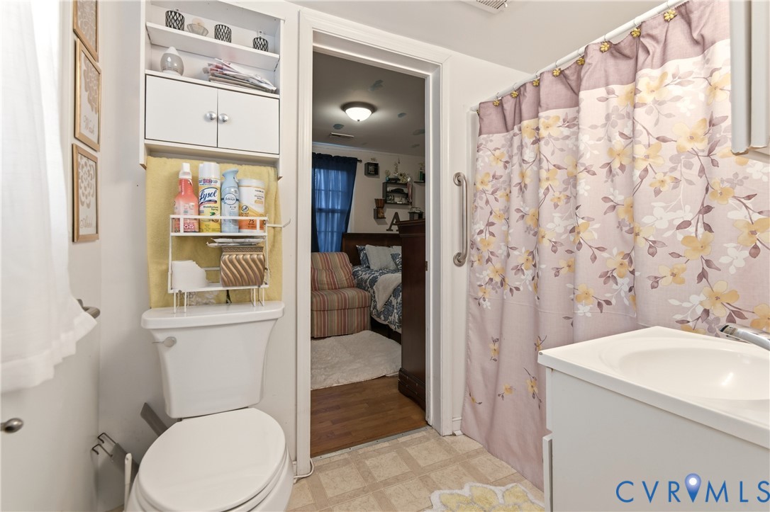 1311 Williamsburg Road Richmond, VA 23231 - Photo 9 of 32 a bathroom with a toilet sink and shower