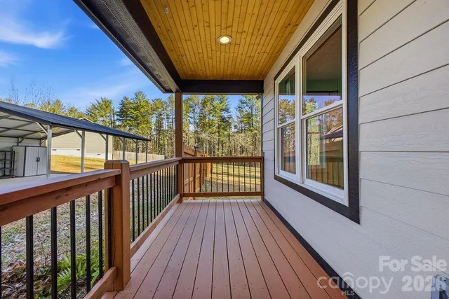 a view of balcony with wooden floor