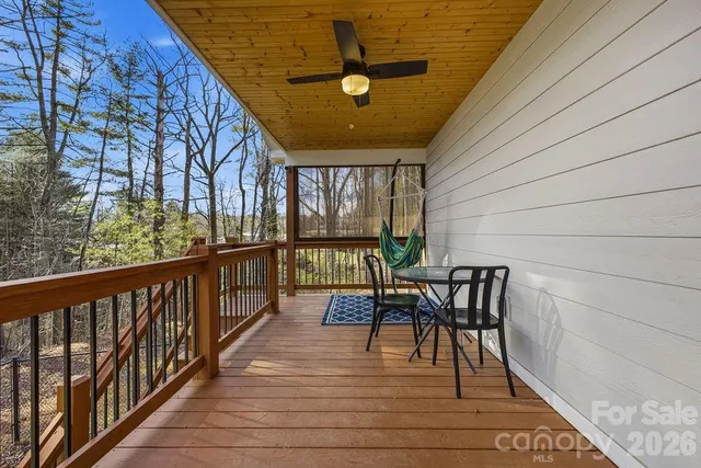 a view of a patio with a table and chairs