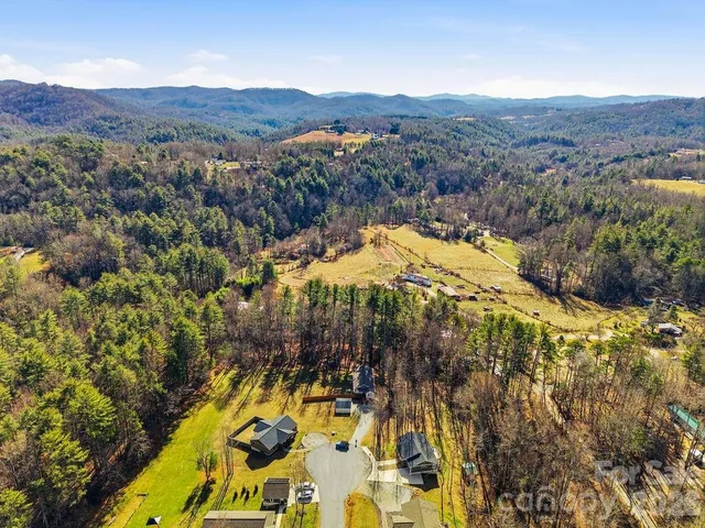 a view of a yard with mountains