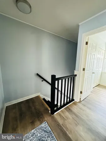 a view of entryway with wooden floor