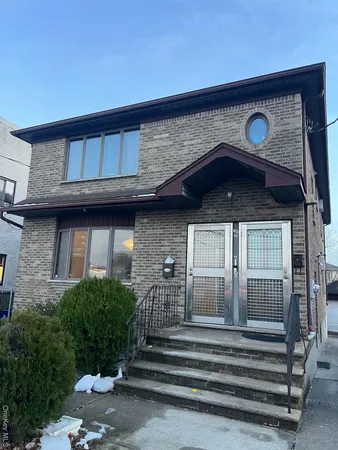 a front view of a house with stairs