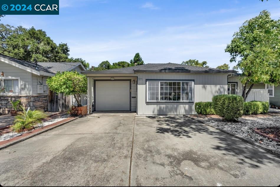 1431 Coventry Road Concord, CA 94518 - Photo 1 of 1 a view of a house with a yard and potted plants