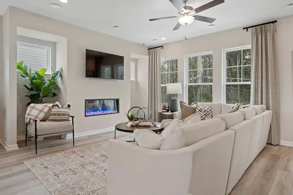 a living room with furniture and a flat screen tv
