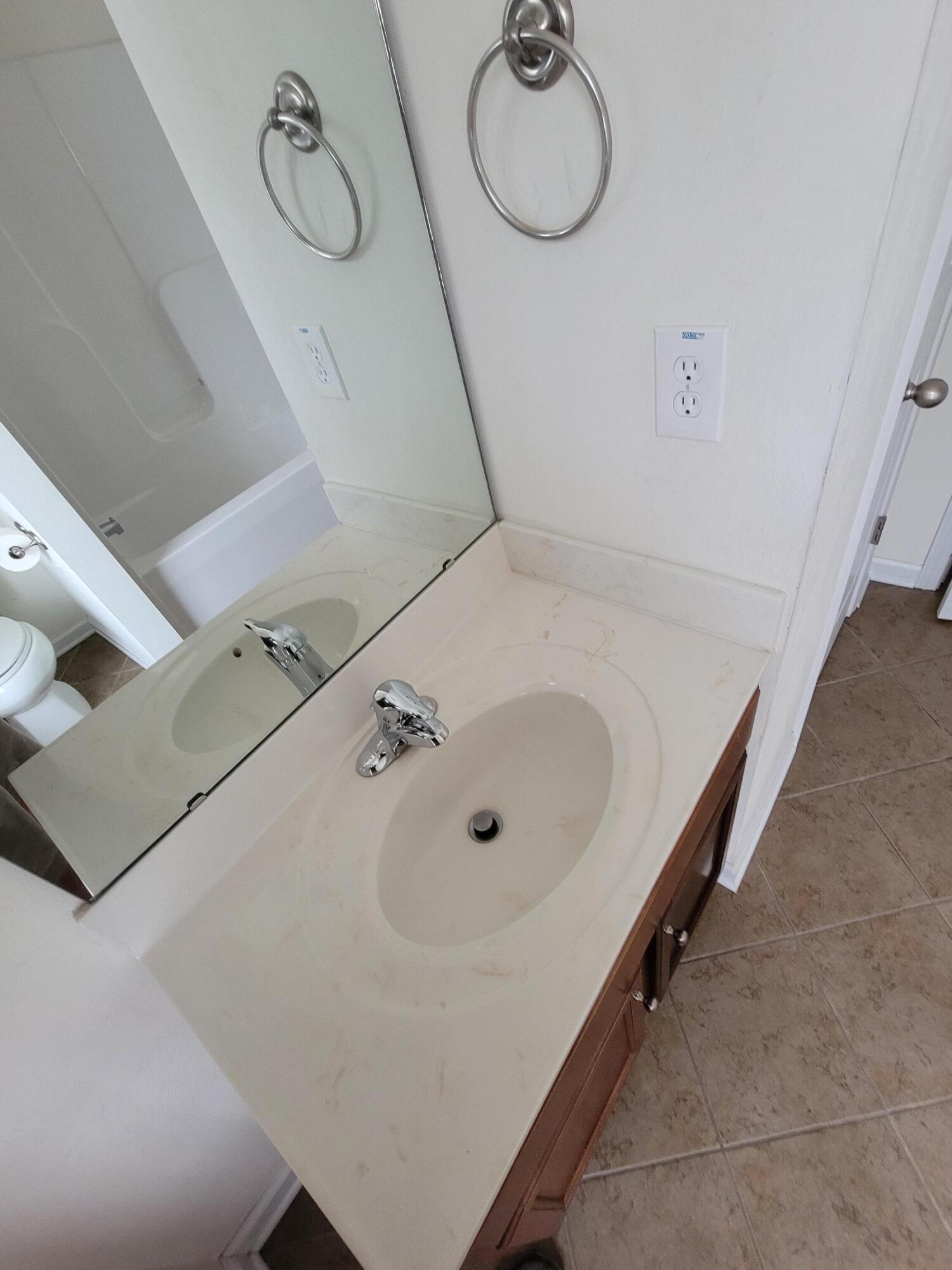 1122 Updike Road Roanoke, VA 24014 - Photo 3 of 14 a bathroom with a sink and mirror