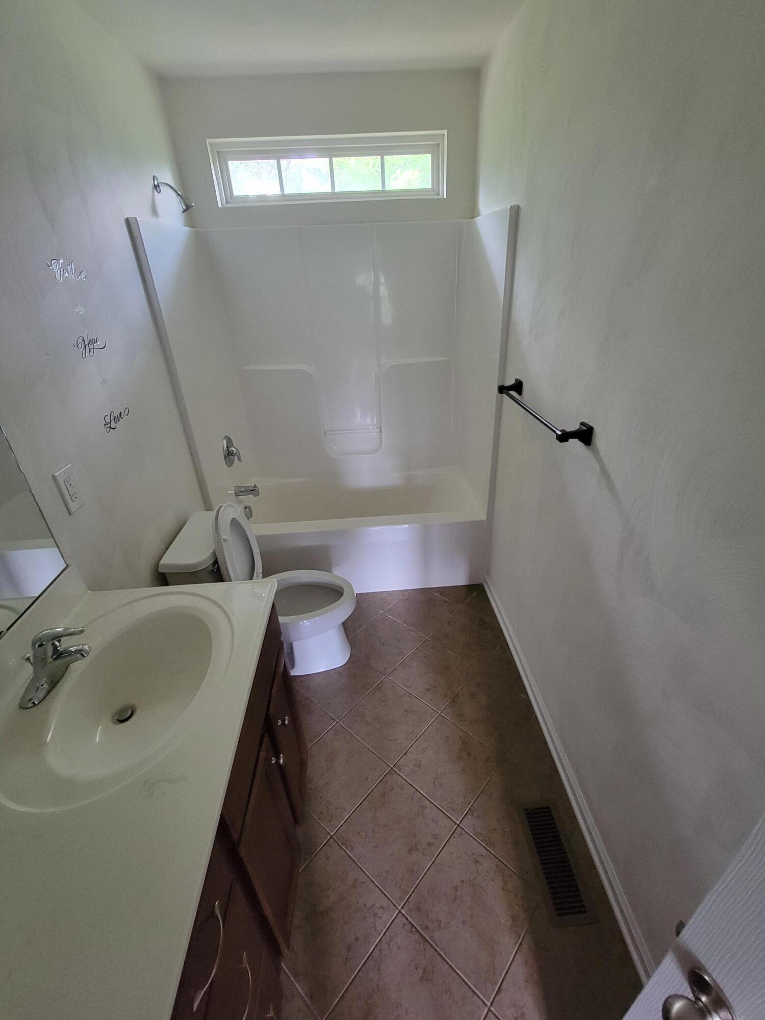 1122 Updike Road Roanoke, VA 24014 - Photo 6 of 14 a bathroom with a sink and a tub