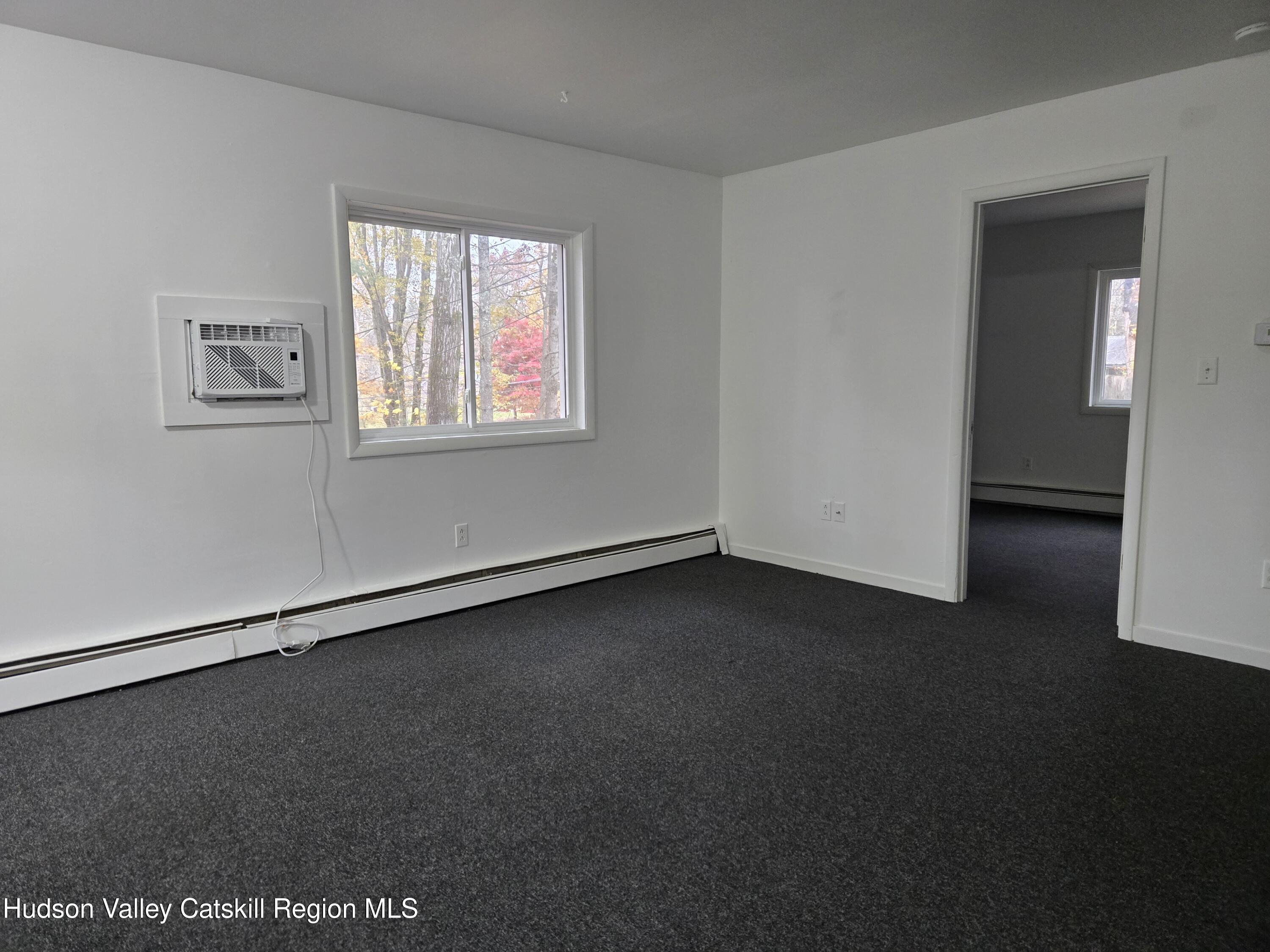 1221 Church Road, Unit 2 Saugerties, NY 12477 - Photo 5 of 7 an empty room with a window