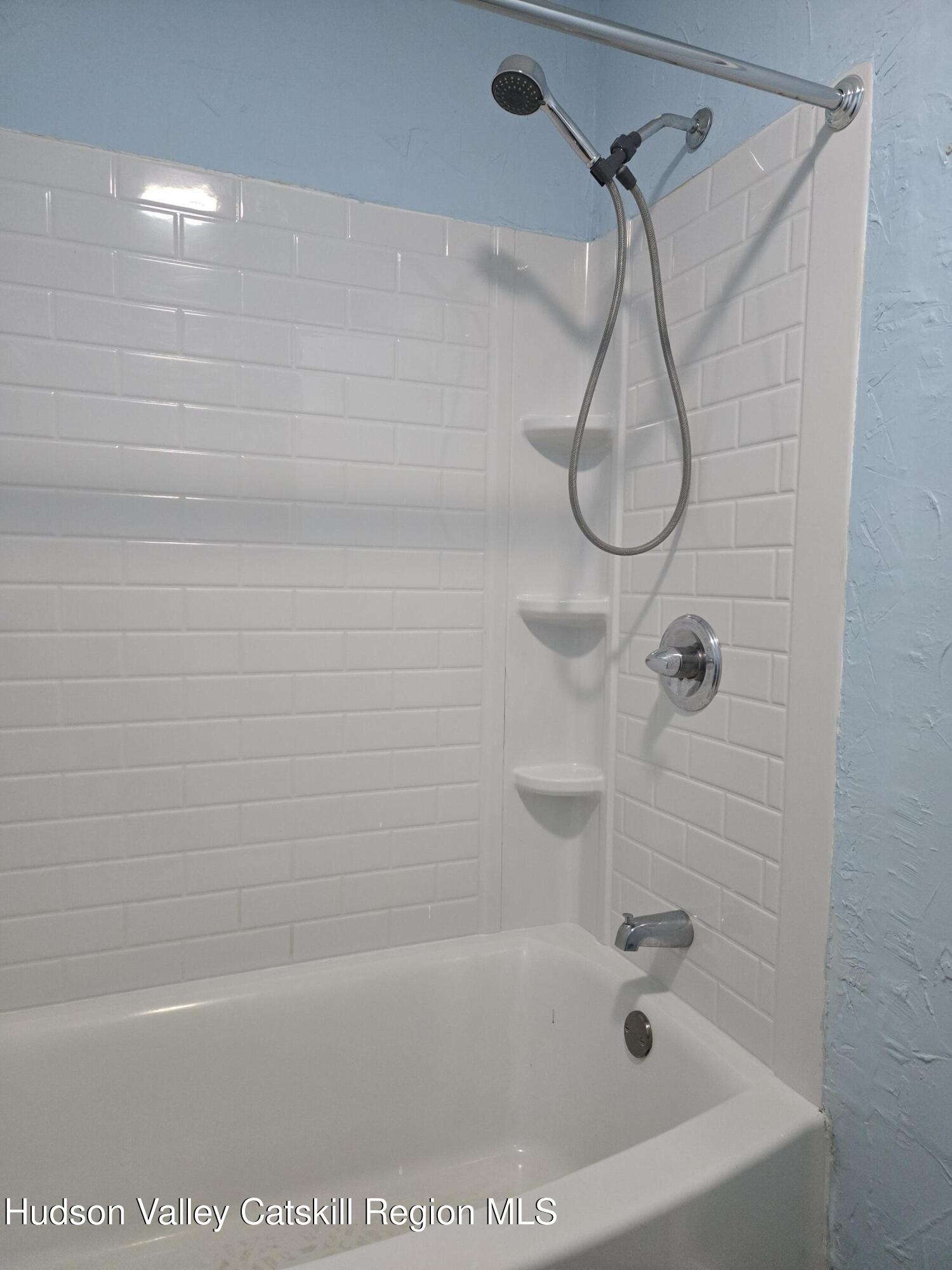 1221 Church Road, Unit 2 Saugerties, NY 12477 - Photo 6 of 7 a bathroom with a bath tub with a shower