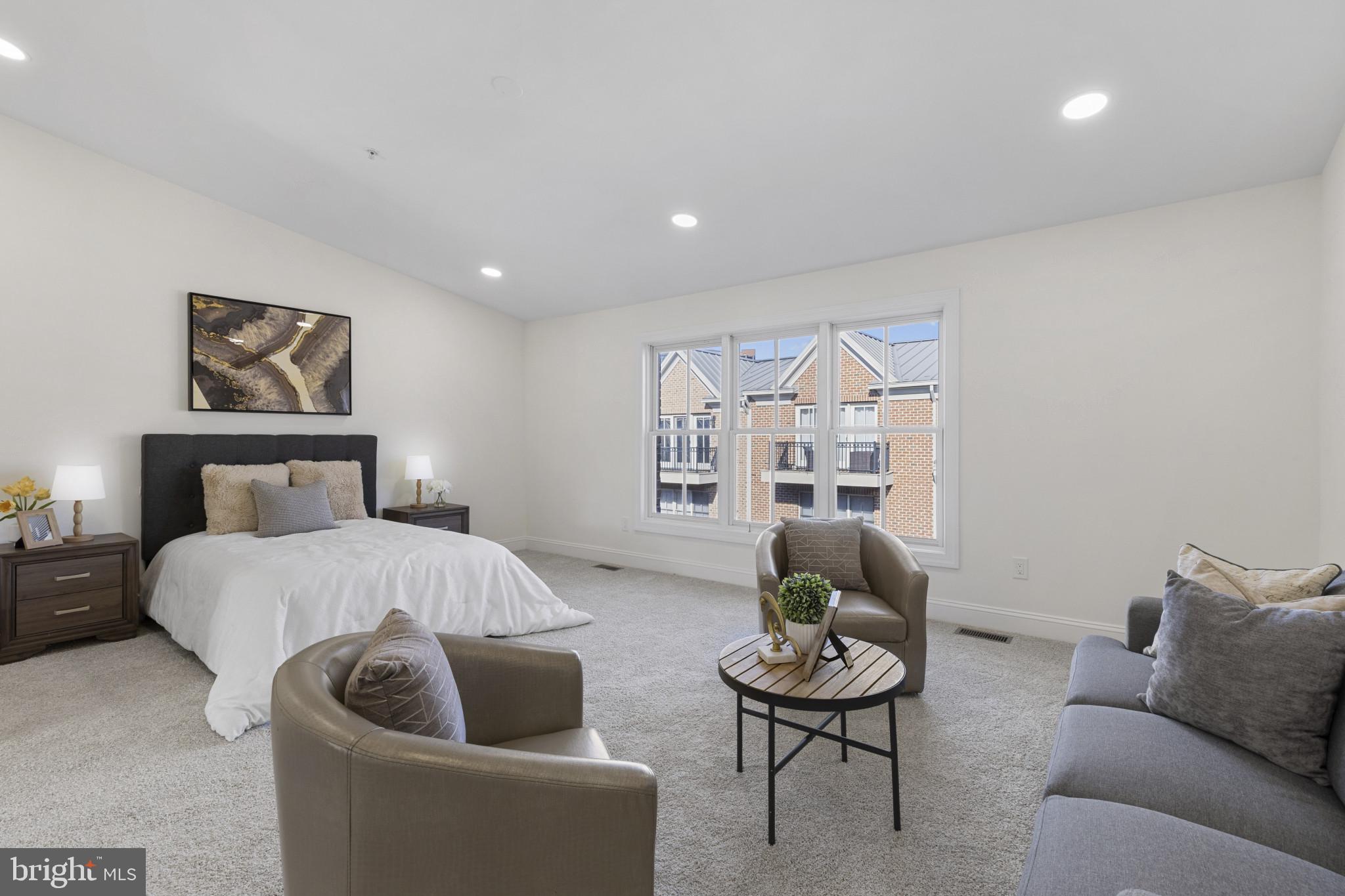 1256 Dockside Circle Baltimore, MD 21224 - Photo 13 of 41 a bedroom with a bed and a couch