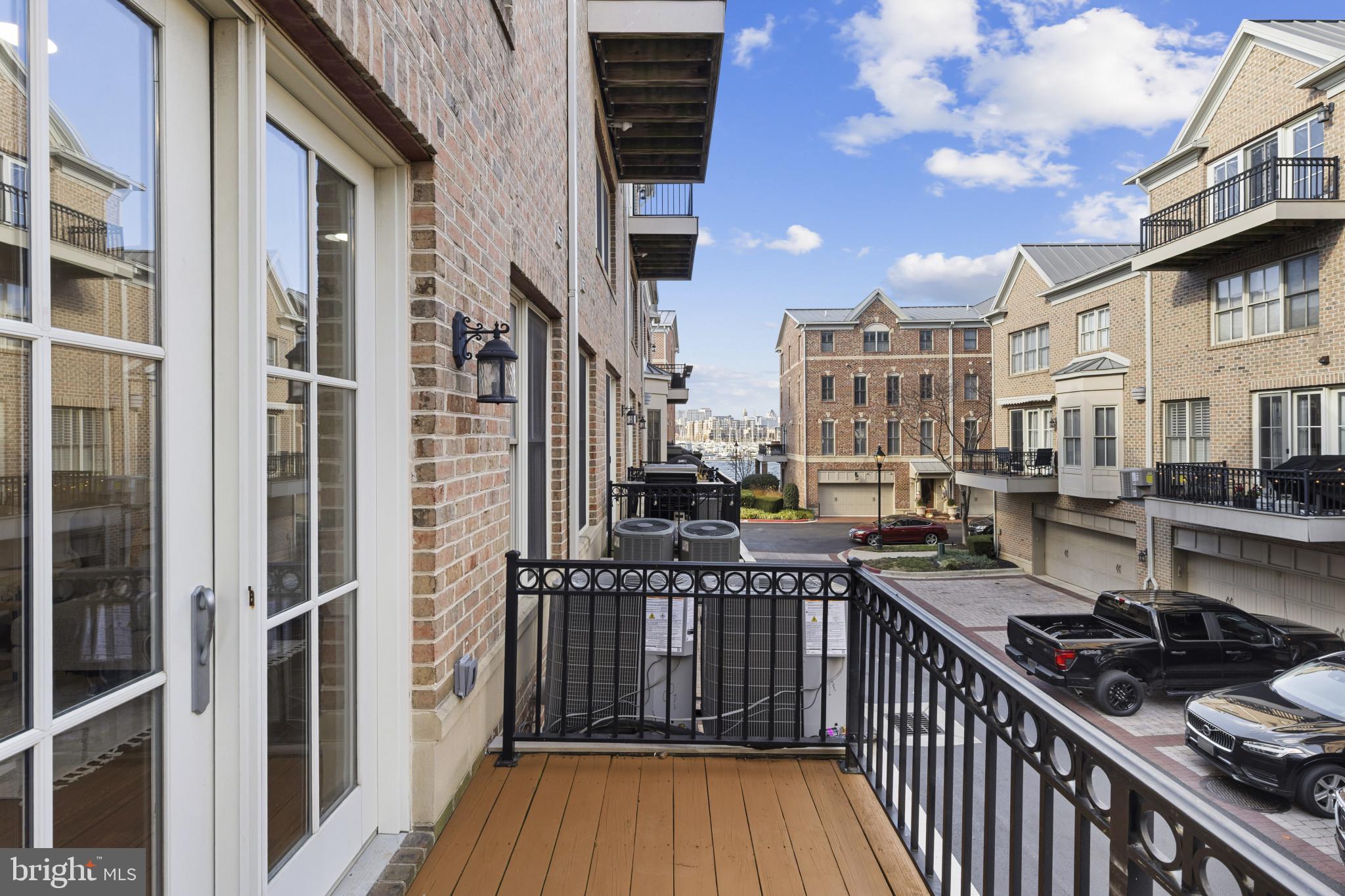 1256 Dockside Circle Baltimore, MD 21224 - Photo 22 of 41 a view of a balcony with wooden floor and a stove