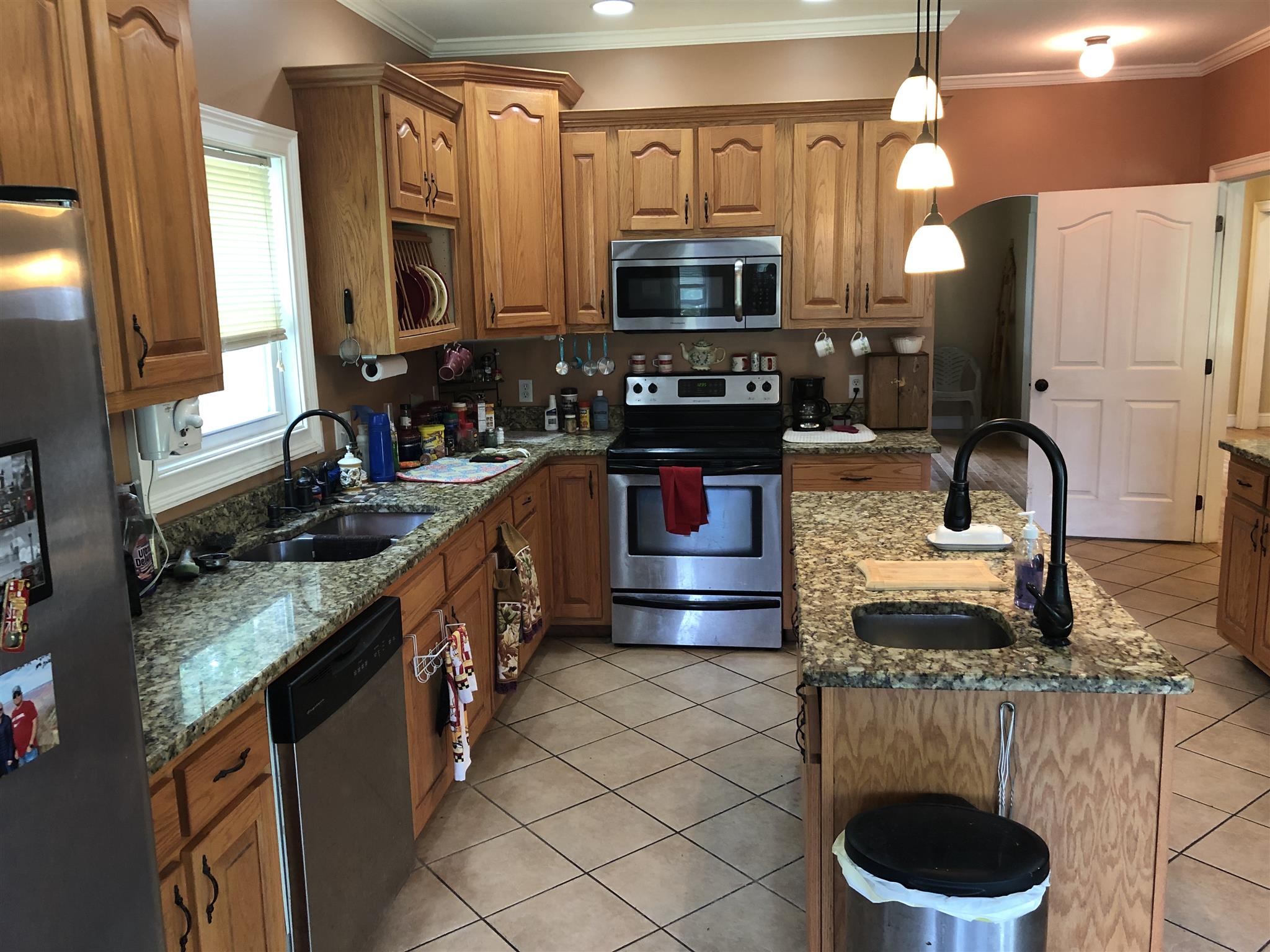 374 Eagle Lake Road Coalmont, TN 37313 - Photo 17 of 28 a kitchen with stainless steel appliances granite countertop a sink stove and cabinets
