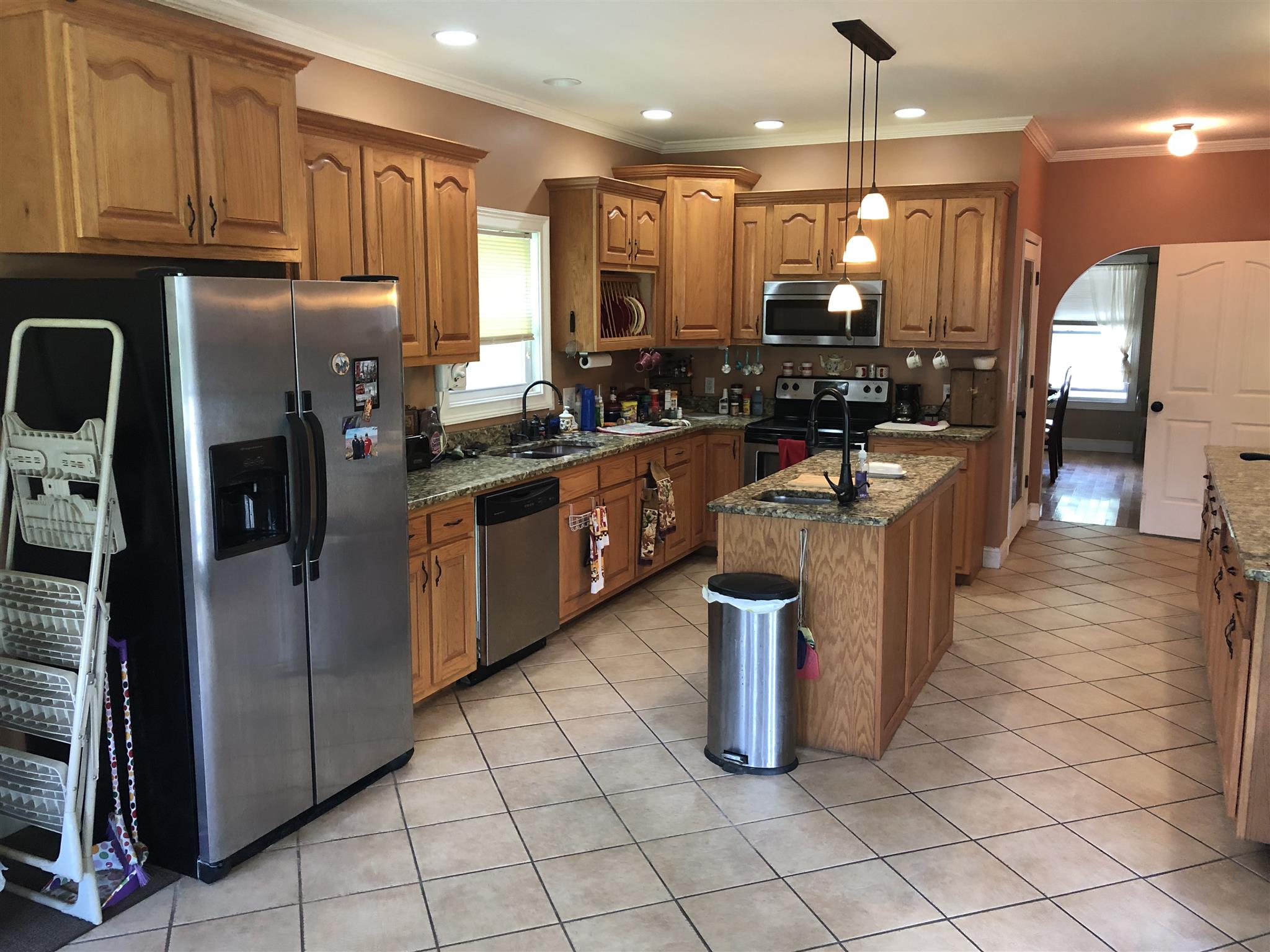 374 Eagle Lake Road Coalmont, TN 37313 - Photo 18 of 28 a kitchen with stainless steel appliances granite countertop a stove a sink and a refrigerator