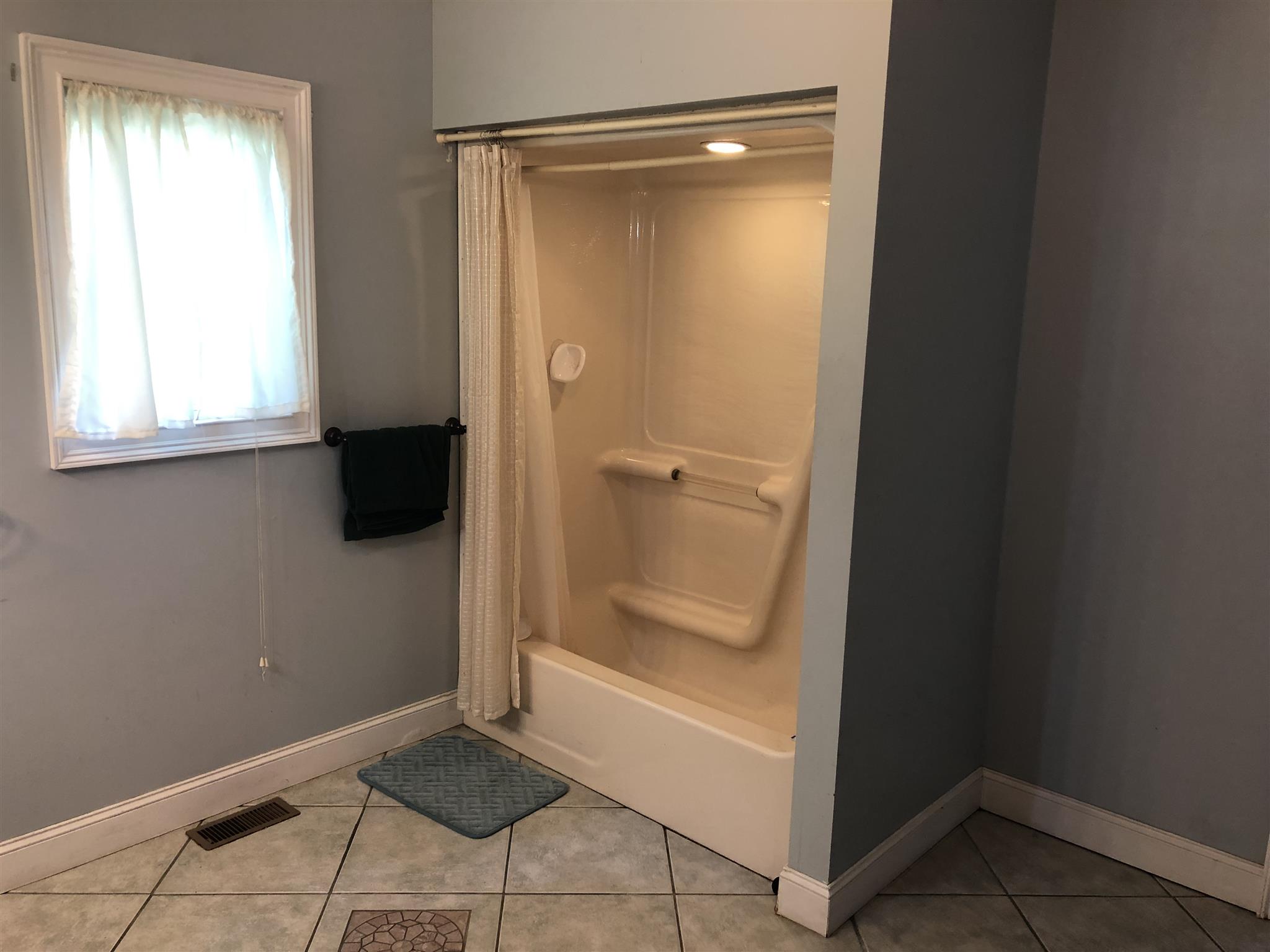 374 Eagle Lake Road Coalmont, TN 37313 - Photo 22 of 28 a bathroom with a bath tub and a shower